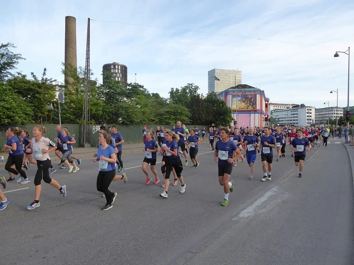 Runners participating in the Royal Run 10 km along Hammerichsgade street in Copenhagen